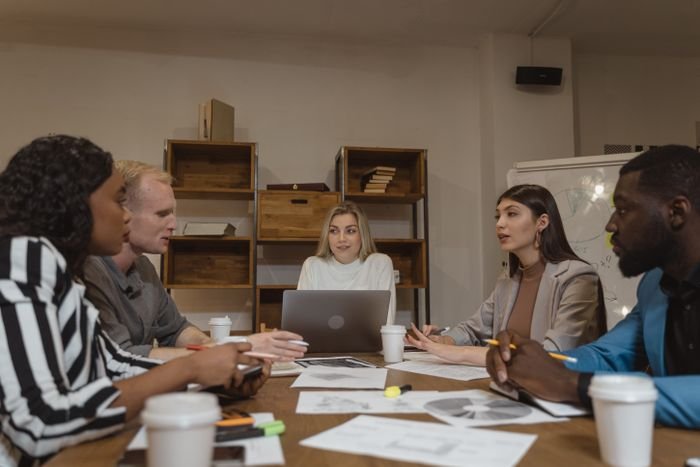 A leadership team working through an operating plan around a table