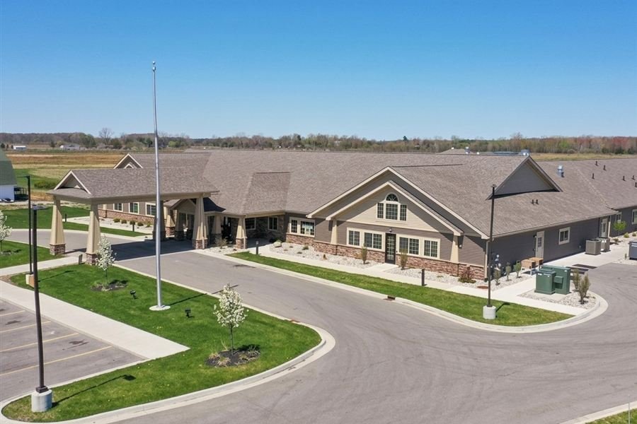 Aerial view of a single-story assisted living and memory care community with a covered entrance
