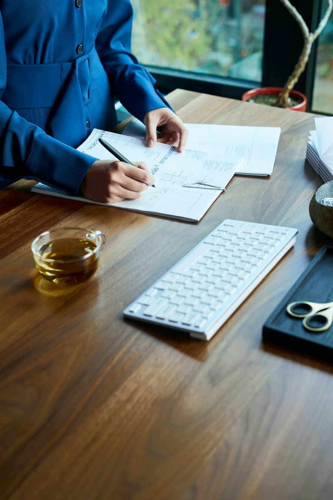 A capital partner working through loan documents at a desk