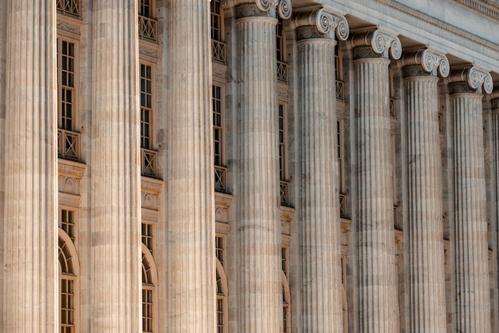 A courthouse with stone columns, representing a court-appointed receivership